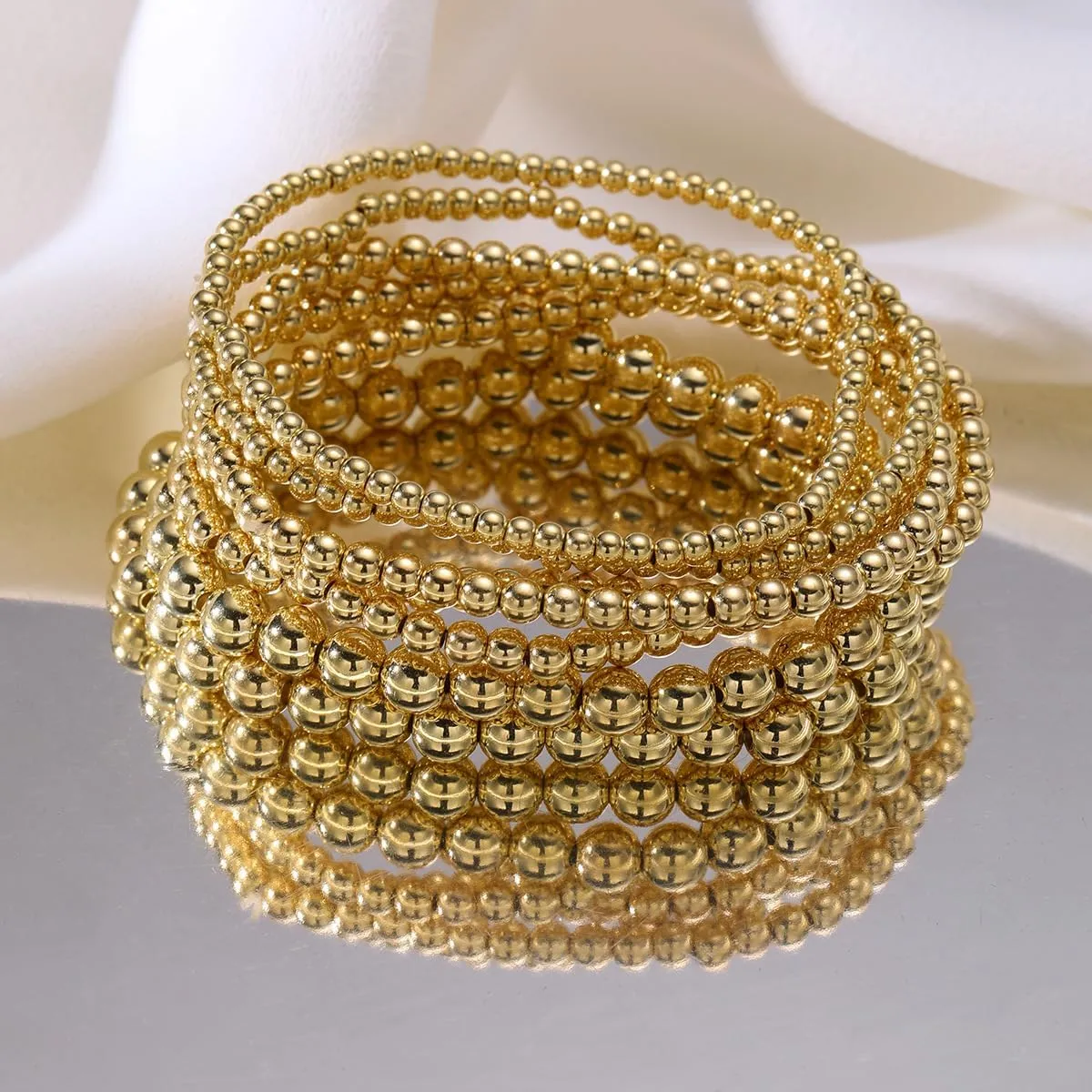 7PCS Layered Beaded Bracelets Set for Women Trendy Stretch Elastic Round Ball Beads Bangles Boho Chunky Gold Stackable Bracelets Dainty Jewelry for Gifts