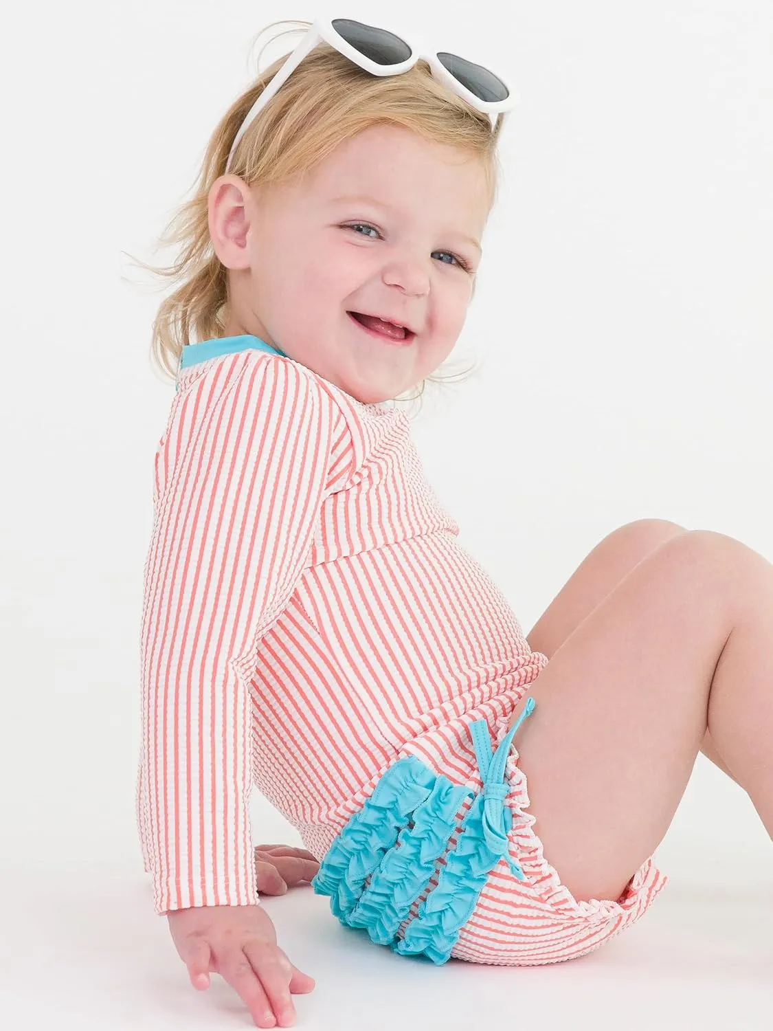 RuffleButts Baby/Toddler Girls Seersucker Long Sleeve One Piece Rash Guard Swimsuit with UPF 50  Sun Protection